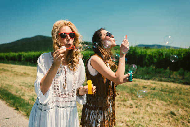 istock Women Blowing Bubbles on the Road. 804263636