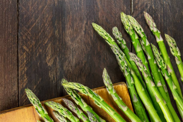 istock Green asparagus stalks, overhead photo with copy space 804263724
