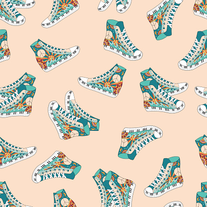 Seamless pattern with colorful hippie hight sneakers. Hippy ornamental gum shoes. Hippie art background. Boho vintage fashion.