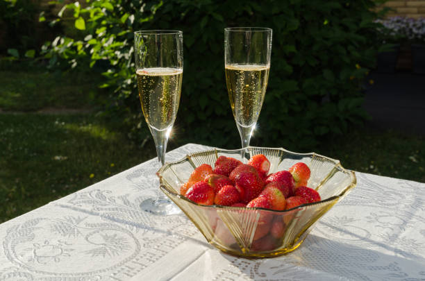 istock Two glasses with champagne and strawberries 804264372