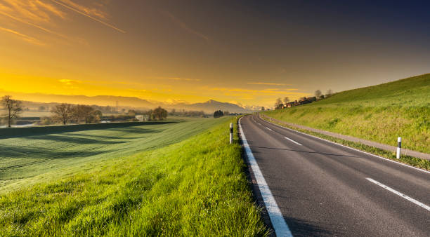 istock Asphalt road along the pasture 804272308