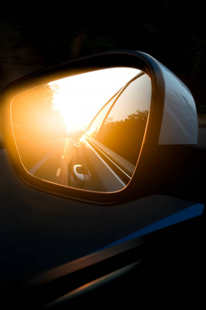 istock car side view mirror on the road 804272742