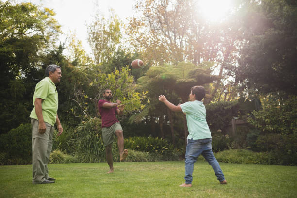istock Multi generation family playing with rugby ball at park 804275066
