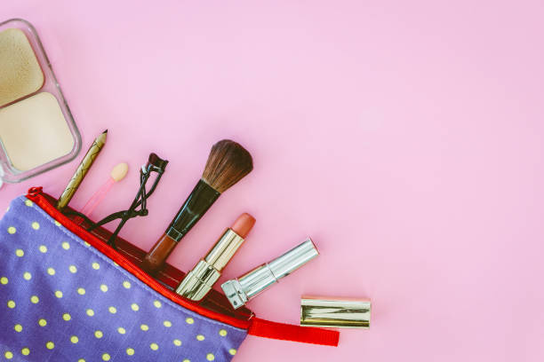 istock Make up bag with cosmetics on pink background 804284074