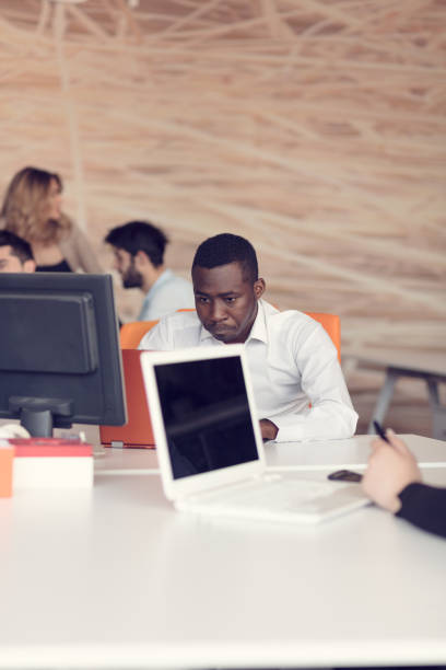 istock Handsome African American looking at the screen with serious face expression 804284128