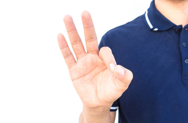 istock Man hands is showing ok sign isolated on white background 804284192