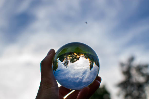 istock Glass ball wiht landscape in hand 804286704