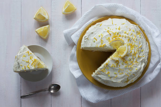 istock Lemon cream sponge cake with zest top view 804291884