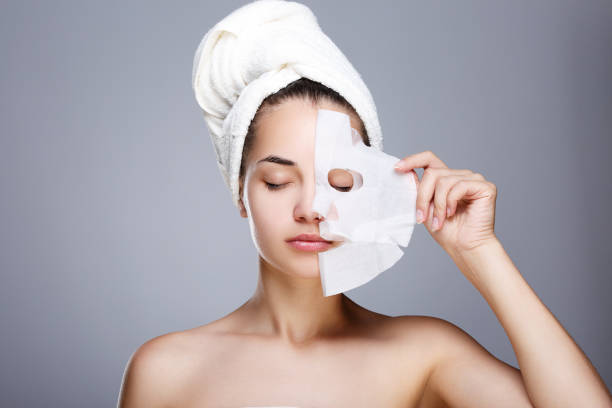 istock Girl with half rended white mask 804295402