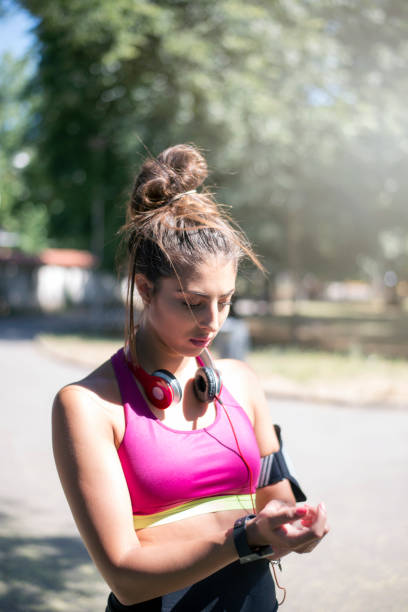 istock Young woman jogger ready to run 804302512
