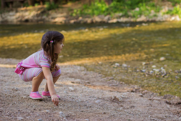 istock Young girl throwing rocks 804304950