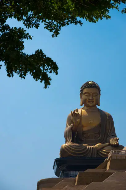 Shakyamuni Buddha Statue and pyramid-styled temple with scenic foliage provide beautiful viewpoints throughout the monastery for visitors.