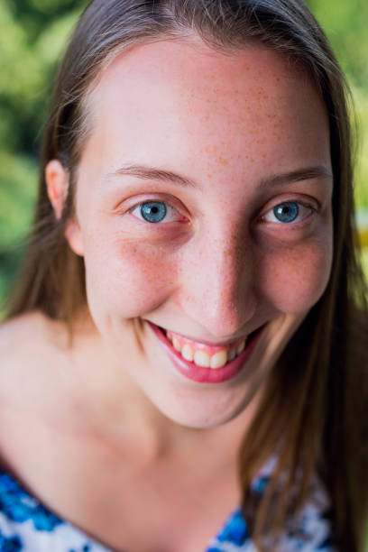 istock Smiling girl with puffed cheeks 804309650