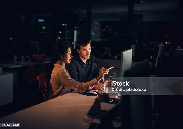 Making The Extra Hours Count In Their Favour Stock Photo - Download Image Now - Office, Dark, Night