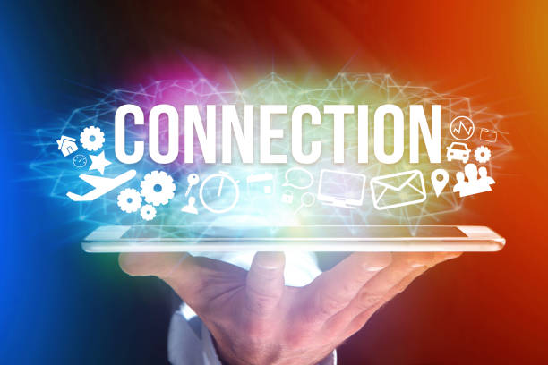 istock Concept of man holding a futuristic interface with connection title and multimedia icons flying all around - Internet concept 804313120