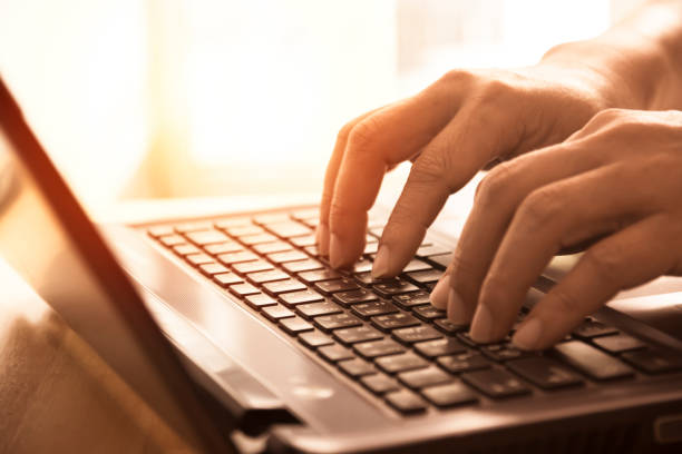 istock Human hands using laptop for working his business at home. 804317216
