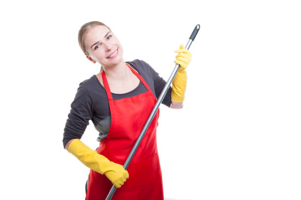 istock Housemaid with apron and gloves cleaning 804317580