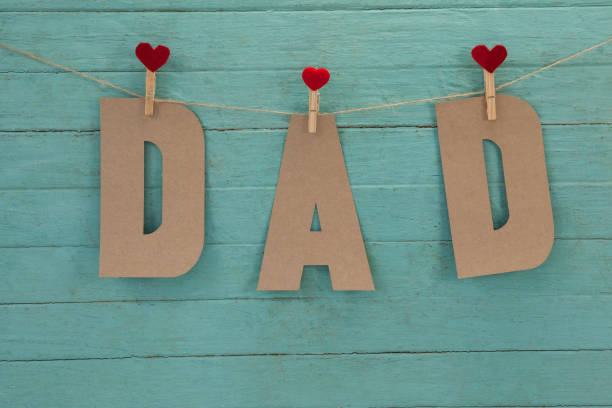 istock Dad text with cloth pegs hanging on rope 804321888