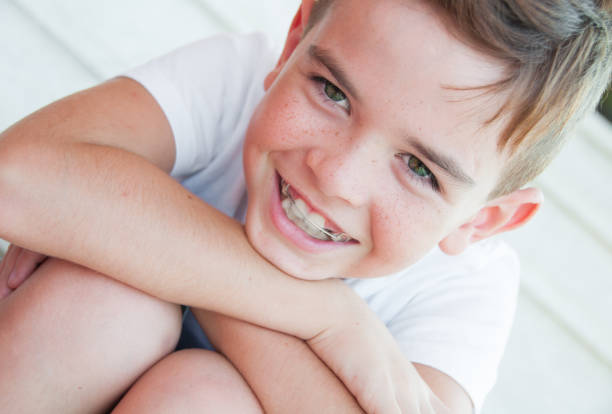 smiling 8 year old boy with freckles