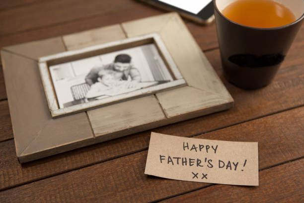 istock Photo frame, lemon tea and card on wooden plank 804342664