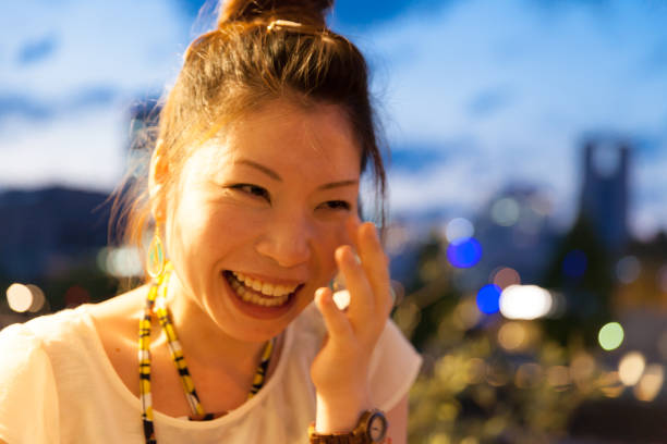 Japanese woman getting emotional Japanese woman getting emotional golden hour drink stock pictures, royalty-free photos & images