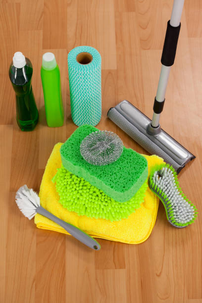 istock Various cleaning equipment on wooden floor 804351204