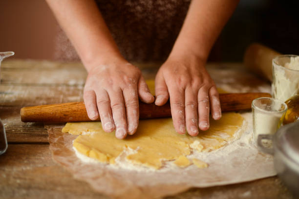 istock Baking background with ingredients for fruit and chocolate cake in rustic kitchen. Eggs, flour, chocolate, berries 804355188