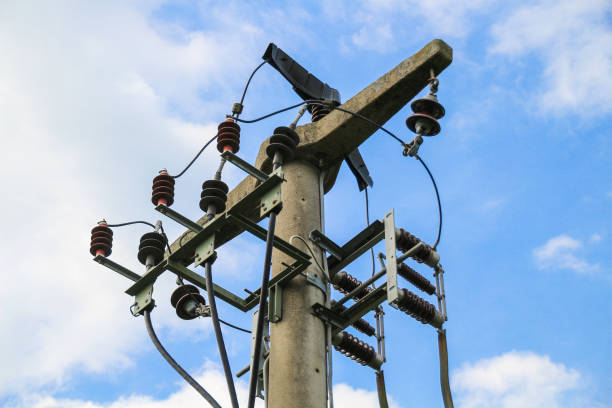 istock Old  electric power pillar against clear blue sky in germany 804358370