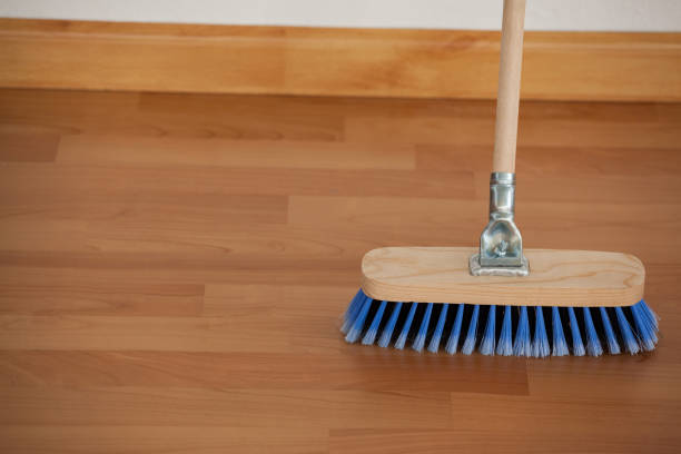 istock Sweeping broom with wooden handle on floor 804367928