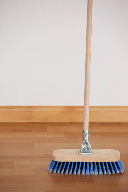 istock Sweeping broom with wooden handle on floor 804367942