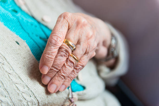 istock Hand of elderly woman with rings 804368030