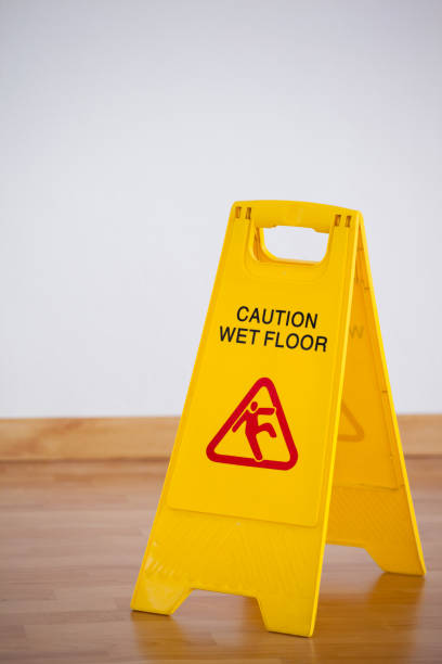 istock Wet floor caution sign on wooden floor 804368512