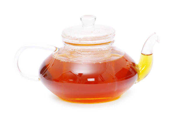 istock Tea being poured into glass tea cup 804373680