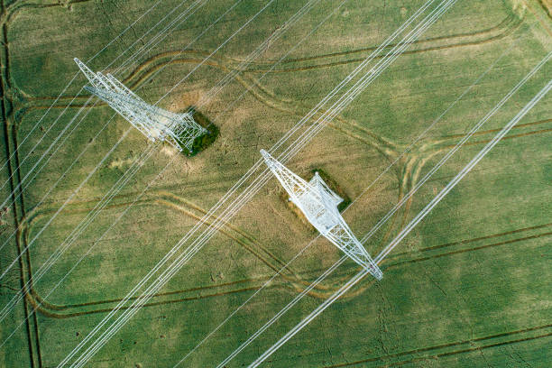 istock Agricultural area, fields, pylons and transmission lines 804384964