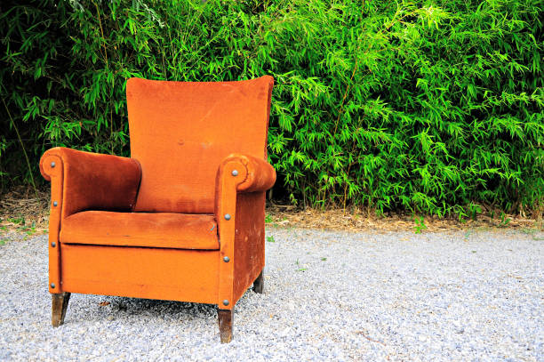 istock Orange Design Armchair with Bamboo Background 804389524