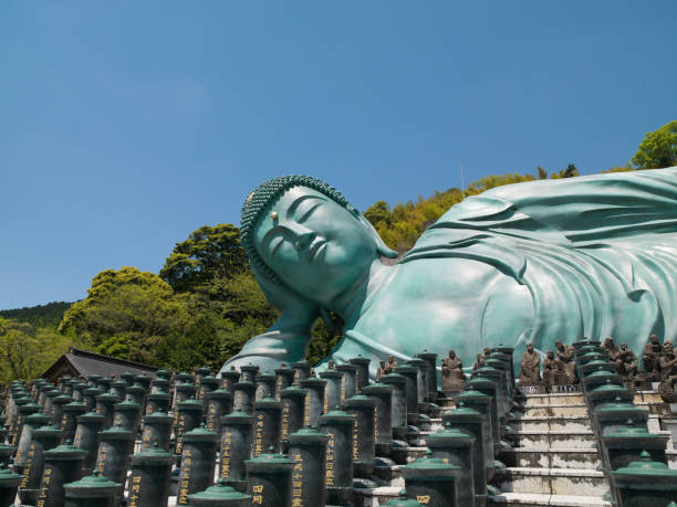 Reclining Great Buddah in Fukuka Sasaguri, Fukuoka Prefecture, JAPAN - 30 MAY 2016 - Nanzo-in Temple. Statue of Acala or Fudo Myo-o - one of the Five Wisdom Kings.Reclining Great Buddha at  Nanzo-in Temple in Sasaguri village, Fukuoka Prefecture, Japan fukuoka city photos stock pictures, royalty-free photos & images