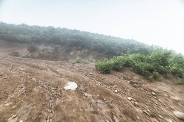 turn rock stone road in mist with tire imprint for automobile commercial,especiall cross country vehicle and sport utility vehicle,