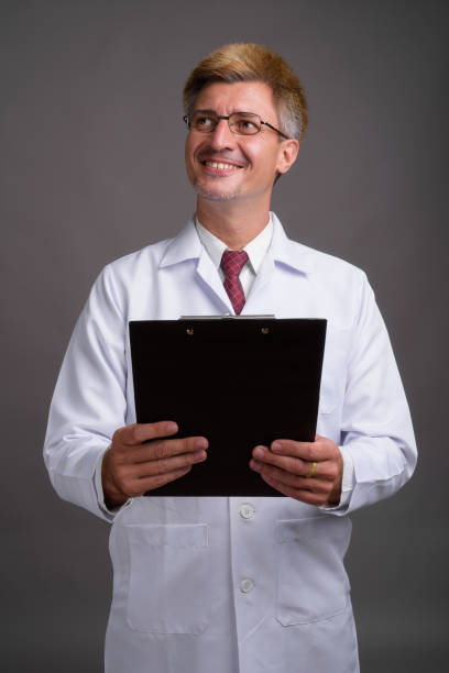istock Studio shot of man doctor against gray background 804415568