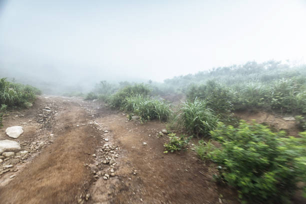 turn rock stone road in mist with tire imprint for automobile commercial,especiall cross country vehicle and sport utility vehicle,