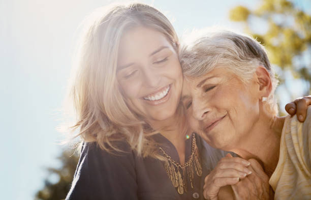 You’re more special to me than words could say Shot of a happy senior woman spending quality time with her daughter outdoors contented emotion photos stock pictures, royalty-free photos & images