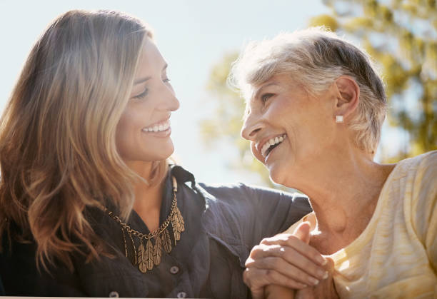 You’re still my golden girl Shot of a happy senior woman spending quality time with her daughter outdoors lens flare offspring daughter human age stock pictures, royalty-free photos & images