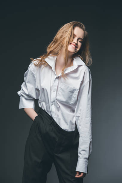 istock woman standing and posing on black 804416450