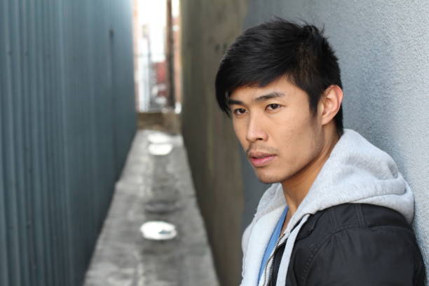 istock Attractive Asian man looking away close up 804416626