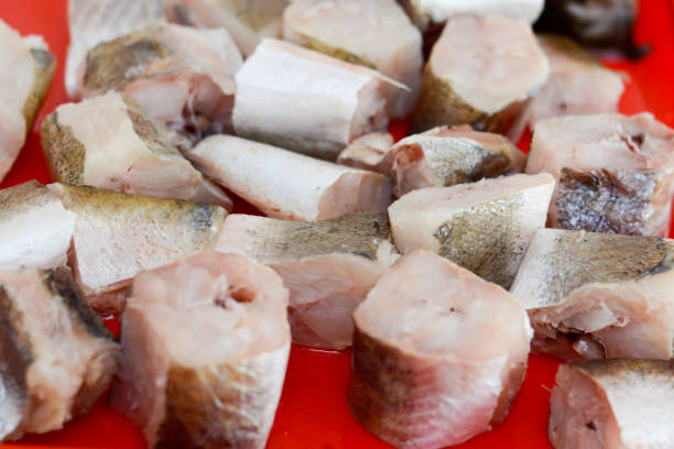 Fish hake sliced and chopped and prepared to be baked