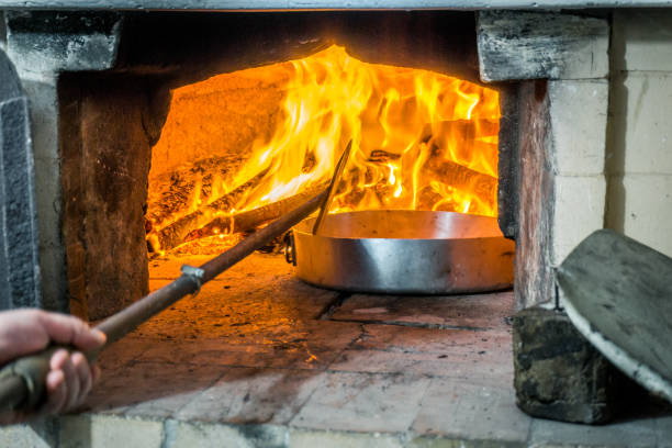 istock Delicious food in oven with firewood 804429438