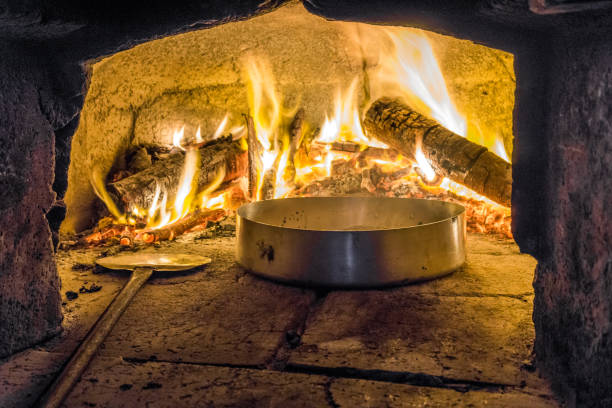 istock Delicious food in oven with firewood 804429448