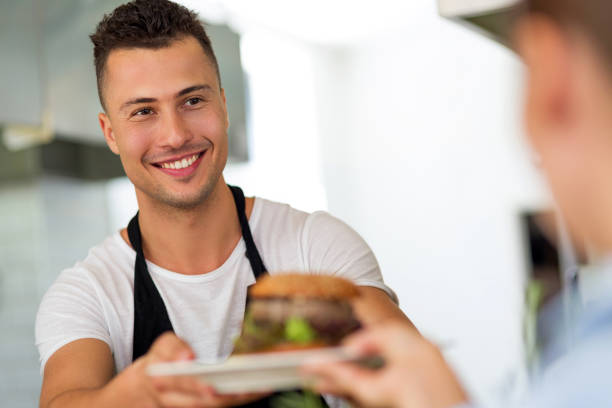 istock Chef with plate of food 804431810