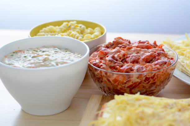 Colorful salads in ceramic bowls and salt cake