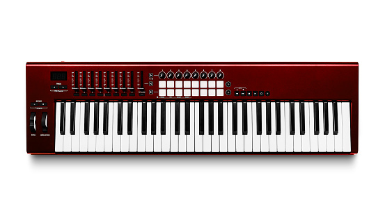 Electronic synthesizer piano isolated on white