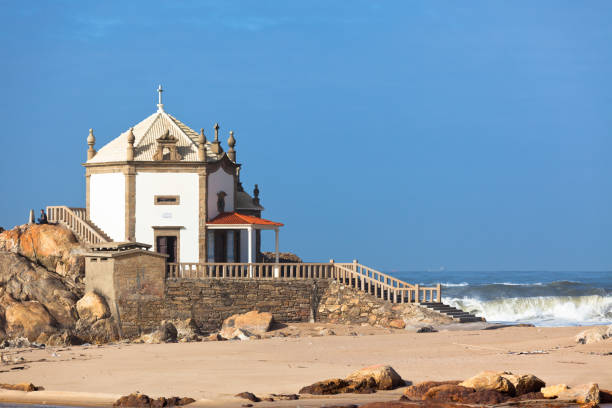 istock White stone chapel on a Portugal coast 804448690